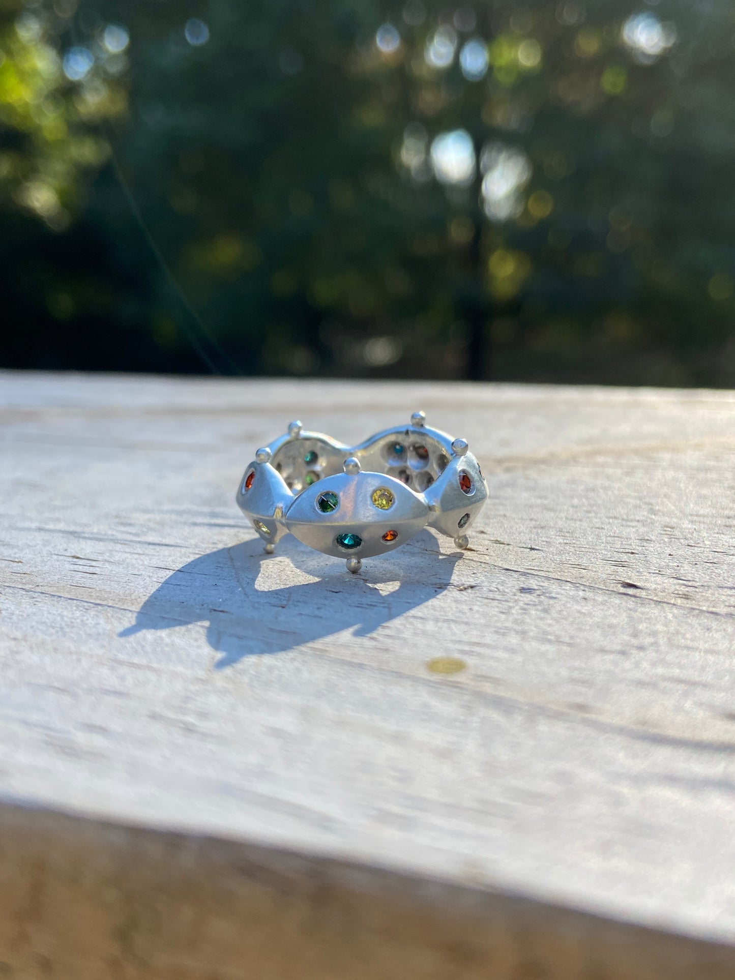 Metal petal jeweled ring
