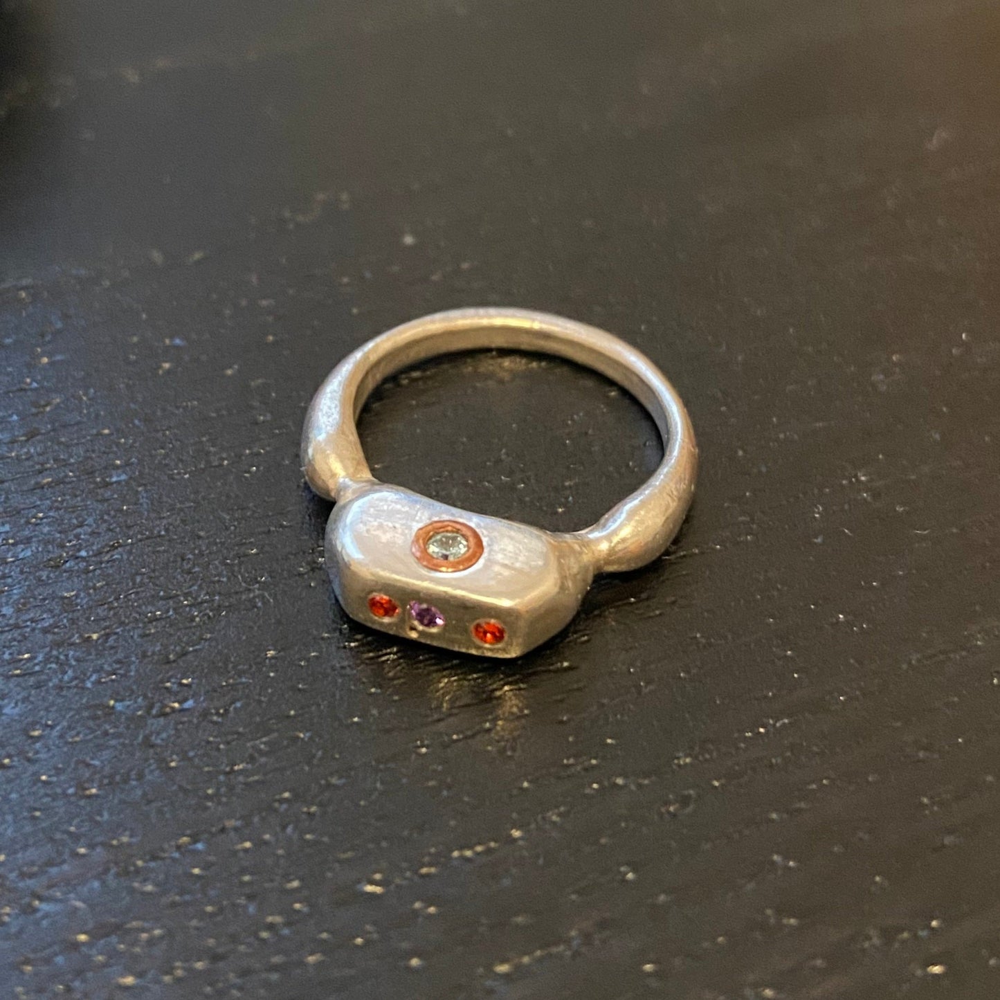 Three top two side stone ring
