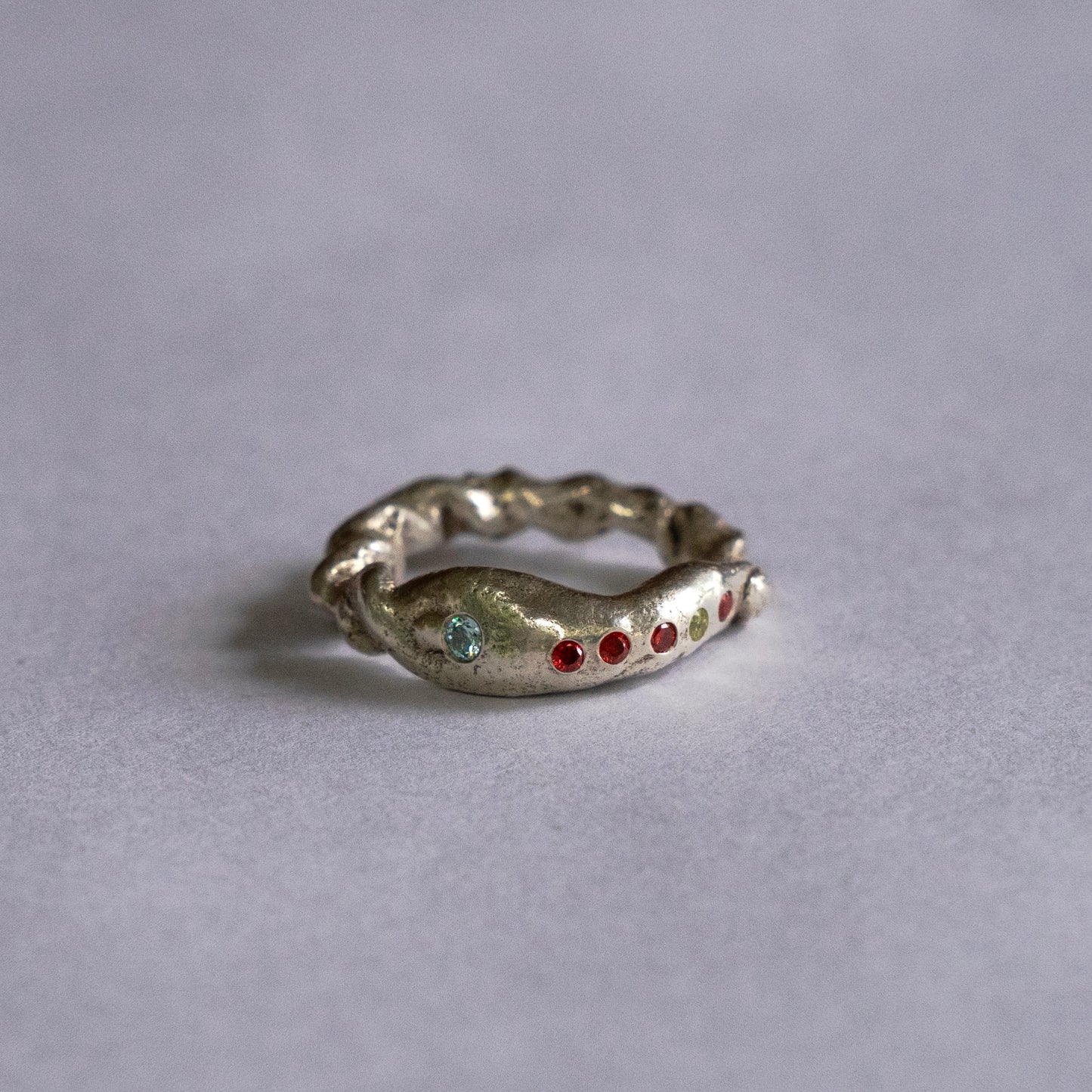 Free form band ring with gems