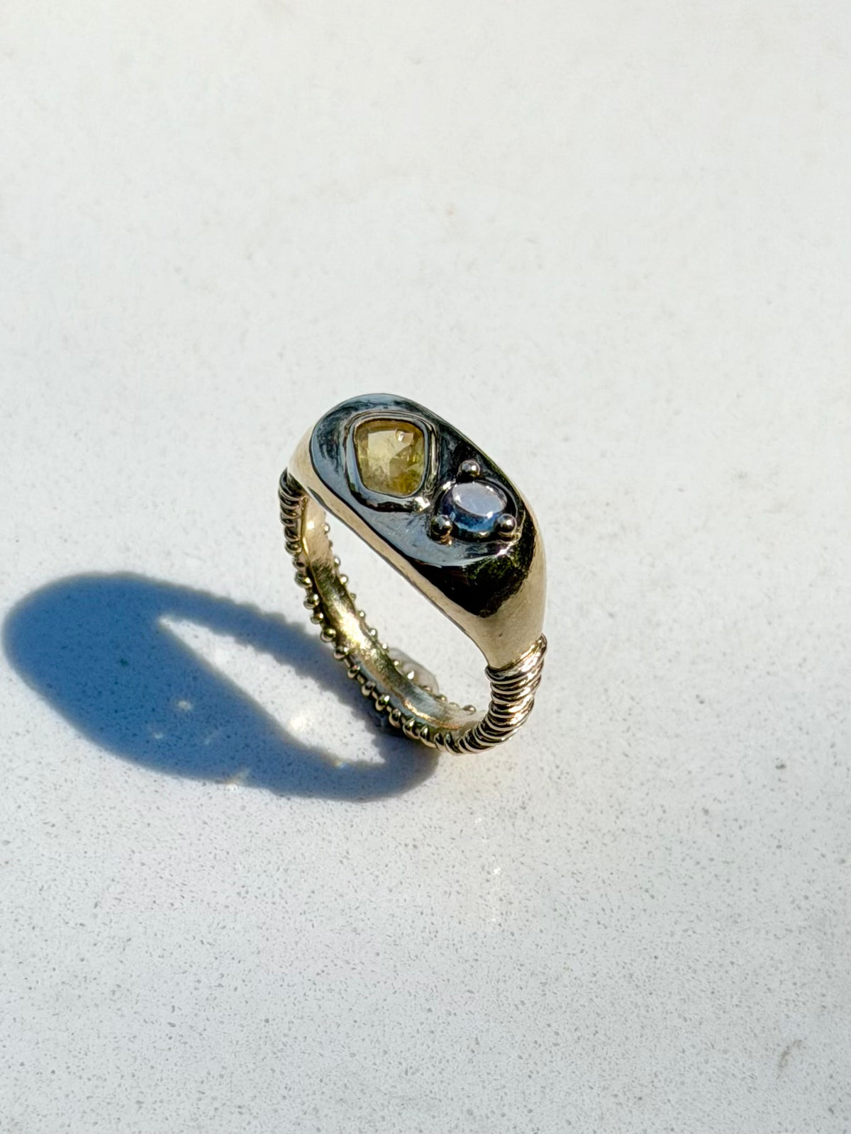 14k Dinner ring with yellow and blue-violet sapphires.