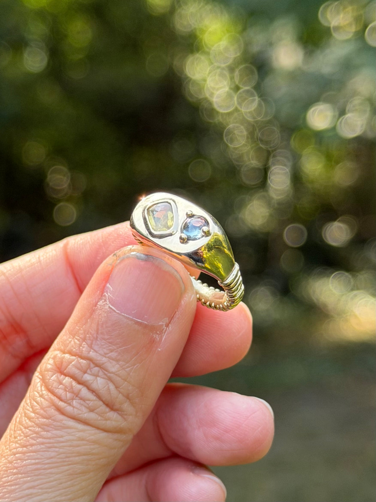 14k Dinner ring with yellow and blue-violet sapphires.
