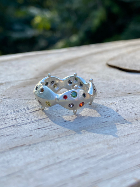 Metal petal jeweled ring