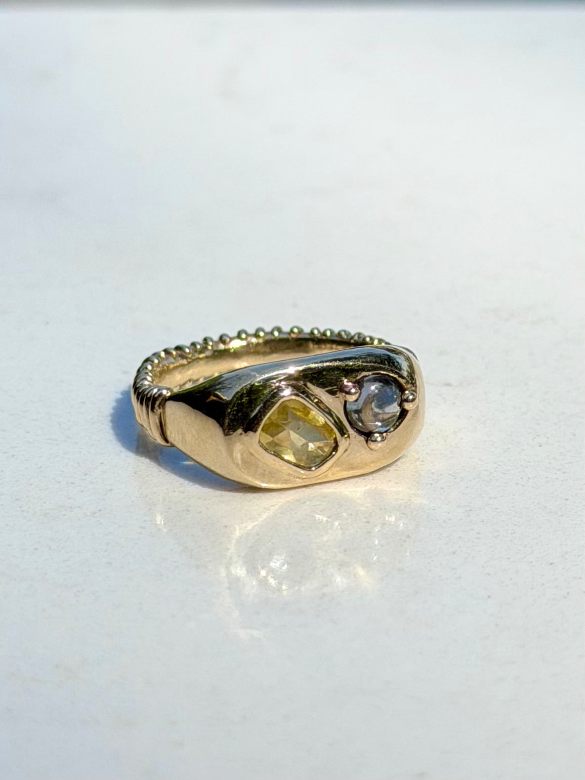 14k Dinner ring with yellow and blue-violet sapphires.